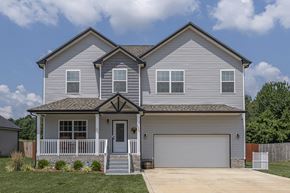 Clarksville house for rent - a white house with a porch and a garage