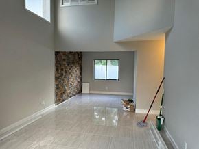 Orlando house for rent - an empty living room with a mop on the floor