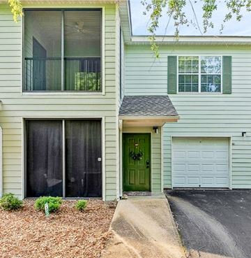 Auburn apartment for rent - a white house with a green door and a driveway