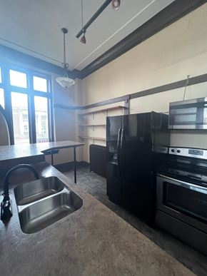 Grinnell apartment for rent - A kitchen with a sink, stove, and oven.