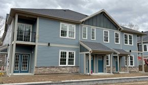 Clifton Park apartment for rent - a blue house with a balcony and a street