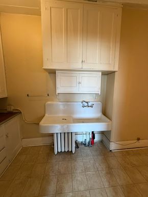 Grinnell apartment for rent - A white sink with a radiator under it.