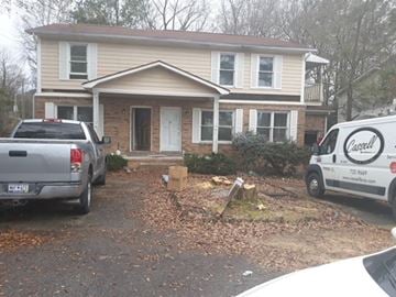 Columbia apartment for rent - a house with a van and a truck parked in front of it