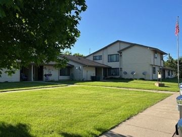 Eagle Bend apartment for rent - a white house with a lawn in front of it