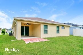 Winter Haven house for rent - the front of a house with a yard and grass