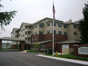 Indianapolis apartment for rent - Exterior of Heritage Place, tall cream and brick building