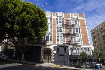 San Francisco apartment for rent - A large building with a black gate in front.