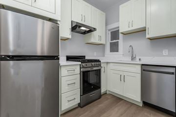 San Francisco apartment for rent - A kitchen with a stainless steel refrigerator, stove, and oven.
