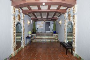 San Francisco apartment for rent - A hallway with a bench and a doorway.