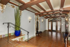 San Francisco apartment for rent - A hallway with a blue vase and a bench.