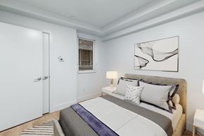 San Francisco apartment for rent - A bedroom with a large bed and a painting on the wall.