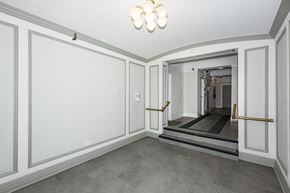 San Francisco apartment for rent - A hallway with a light on the ceiling and a door at the end.