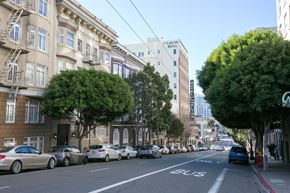 San Francisco apartment for rent - Cars parked on a street with a 5 lane bus lane.