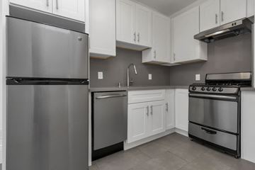 San Francisco apartment for rent - A modern kitchen with a stainless steel refrigerator and oven.