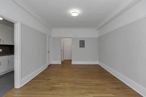 San Francisco apartment for rent - A room with wooden floors and white walls.