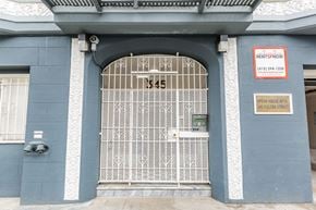 San Francisco apartment for rent - A blue building with a gate and a sign that says RentSFnow.