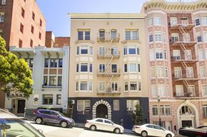 San Francisco apartment for rent - A row of buildings with cars parked in front.