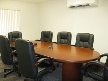 Phoenix apartment for rent - a conference room with a table and chairs