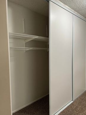 Whittier apartment for rent - Empty white shelves in a room.