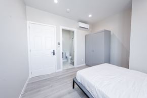 Los Angeles apartment for rent - a white bedroom with a white bed and a gray closet