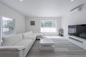 Los Angeles apartment for rent - a white living room with a white couch and a coffee table