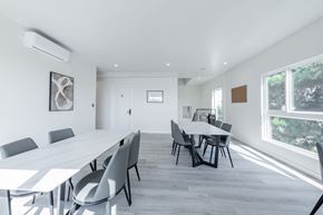 Los Angeles apartment for rent - a large white conference room with a long table and chairs