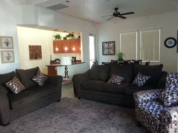 Phoenix apartment for rent - a living room with couches and chairs and a kitchen