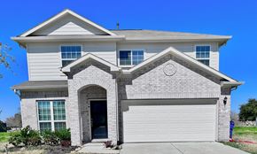 Angleton house for rent - a white house with a garage door in front of it