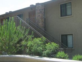 Phoenix apartment for rent - a building with stairs and a balcony and trees