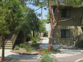 Phoenix apartment for rent - a tree in front of a building with stairs