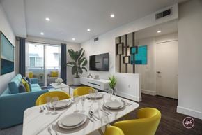 Los Angeles apartment for rent - A modern dining room with a white table set for six.