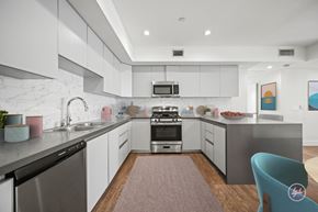 Los Angeles apartment for rent - A modern kitchen with a stainless steel dishwasher and a microwave above the stove.