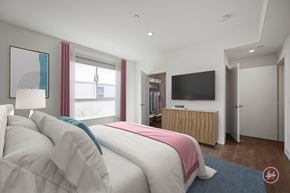 Los Angeles apartment for rent - A bedroom with a large bed and a flat screen TV.