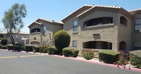 Phoenix apartment for rent - a large tan building with a street in front of it