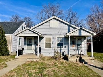 Louisville apartment for rent - A two-story house with a front porch and a covered front door.