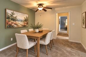 Windsor Mill townhouse for rent - A dining room with a wooden table and chairs.