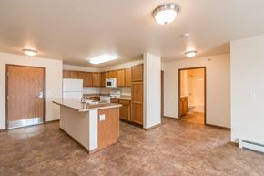 Dickinson apartment for rent - a kitchen with a counter top and a refrigerator