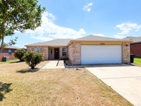 Killeen house for rent - a house with a white garage door and a driveway