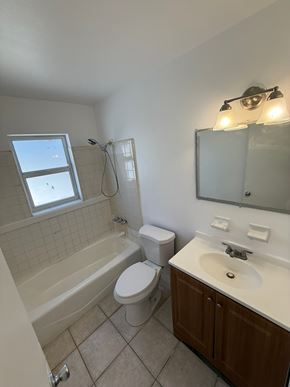 Vero Beach apartment for rent - A bathroom with a toilet, sink, and bathtub.
