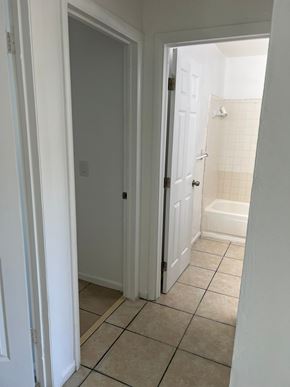 Vero Beach apartment for rent - A white door is open to a bathroom.