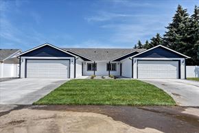 Spokane Valley apartment for rent - A two-story house with a garage on each floor.