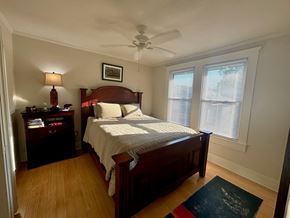 Baton Rouge apartment for rent - a bedroom with a bed and a ceiling fan