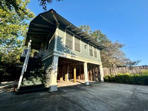 Baton Rouge apartment for rent - the front of a house with a porch and a driveway