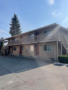 Everett apartment for rent - A two-story house with a balcony on the second floor.