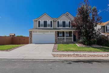 Colorado Springs house for rent - a house with a garage and a driveway in front of it