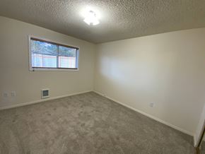 Everett house for rent - A room with a window and carpeted floor.