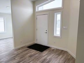 Brandon apartment for rent - A room with a white door and a window.