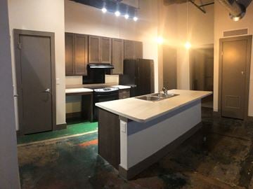 La Crosse apartment for rent - A kitchen with a sink and a stove top oven.
