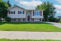 Belleville apartment for rent - a large house with a lawn in front of it