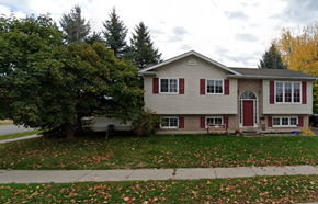Belleville apartment for rent - a house with red shutters and a tree